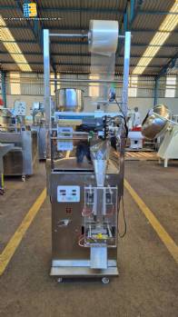 Dosing and packaging machine for granular and powdered products
